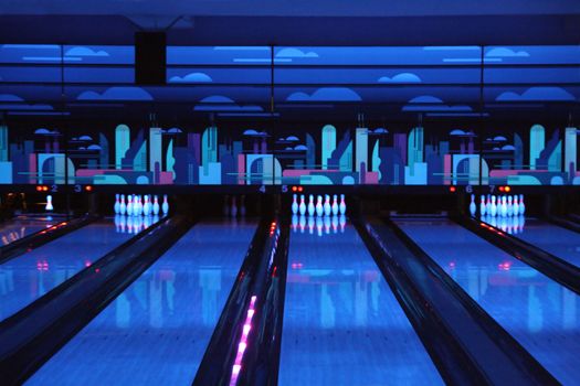 dark blue bowling playing hall