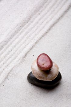 tower of rocks in a sand zen rock garden