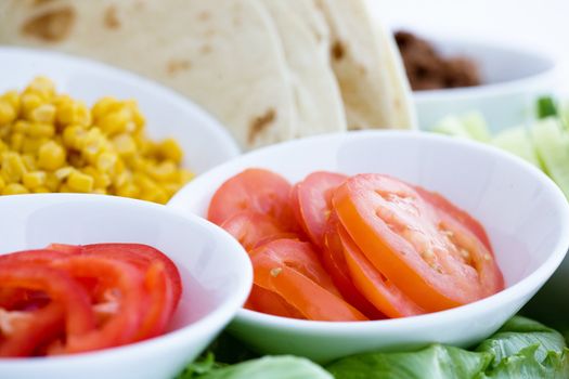 Taco ingredients - shallow depth of field with focus on the tomatoes