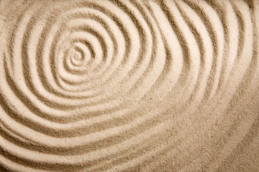 A circular sand swirl background texture abstract