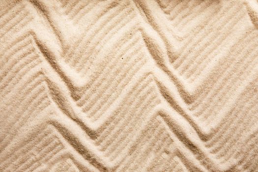 A zig zag background pattern in sand