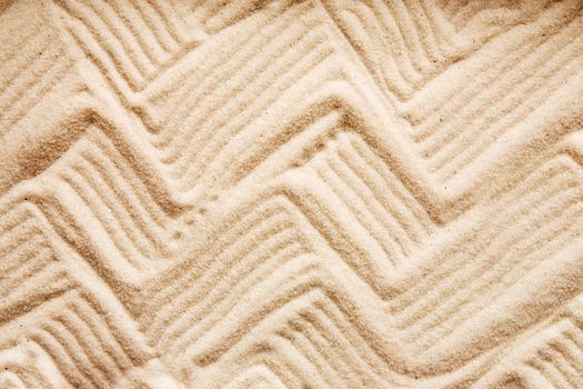 A zig zag background pattern in sand