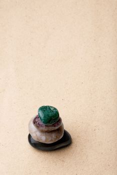 A tower of rocks in a very minimalist zen rock garden