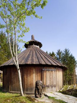 Old viking architecture with statue 