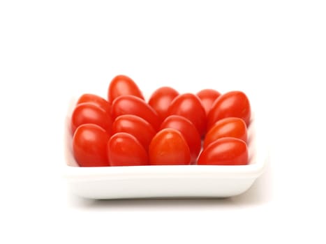 Cherry tomatoes on white plate and white background 