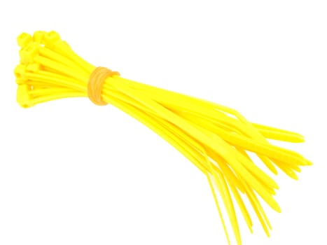 Yellow plastic wire ties in bundle on white background