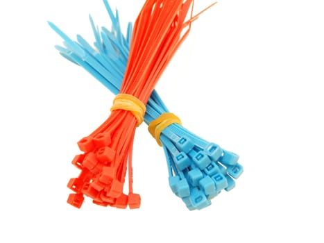 Blue and red plastic wire ties in bundle, on white background