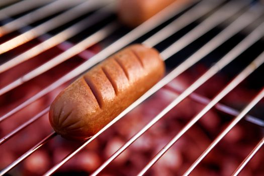 A hotdog on a grill 