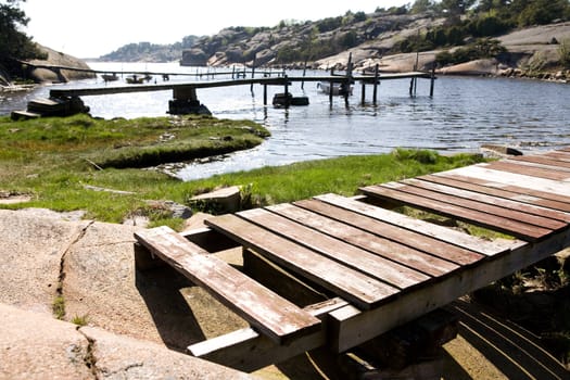 A number of old docks on an ocean inlet