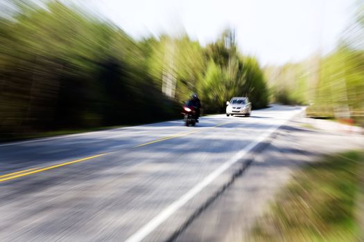 A motion blur image of a speeding car
