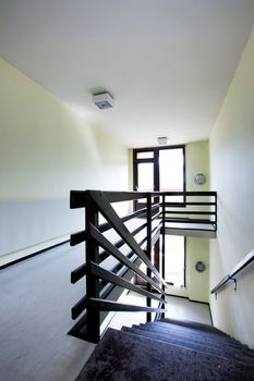 A staircase in a concrete apartment building