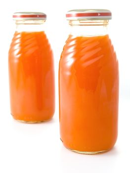Close-up of baby food isolated on white background (carrot juice)
