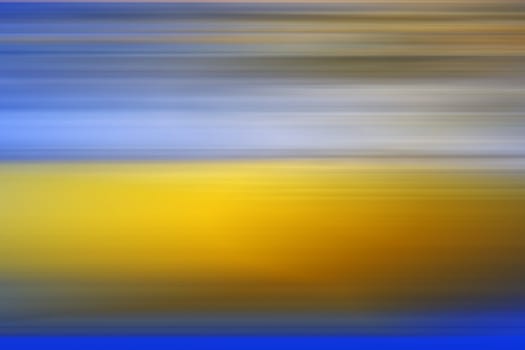 A yellow and blue abstract blur background