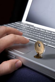 A key locking a laptop computer