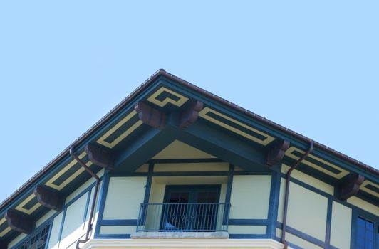 Blue And White Facade Building Corner With Balcony