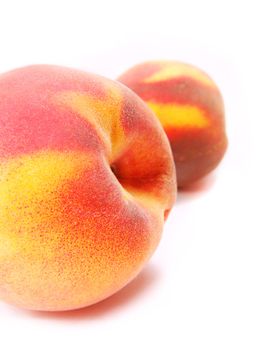 two peaches isolated on white 