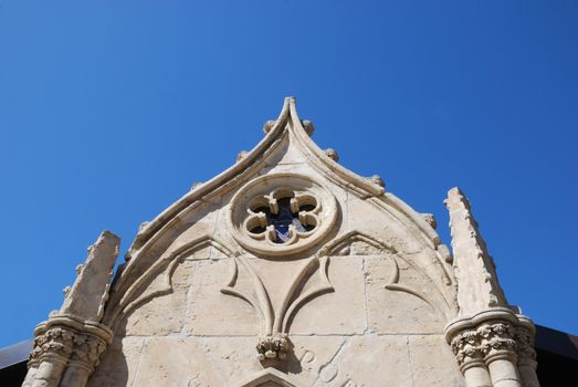 White Chapel Wall Against Blue Sky