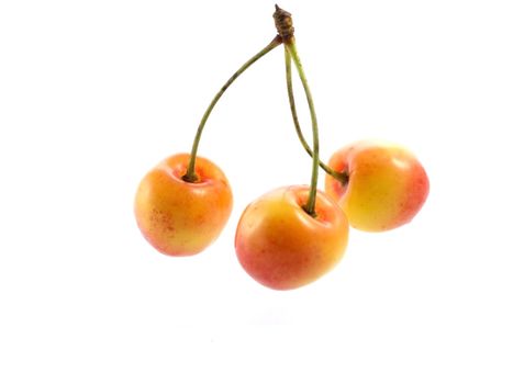 Close-up of sweet cherries isolated on white