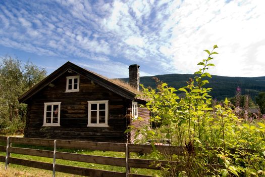 An antique log house in rural Norway