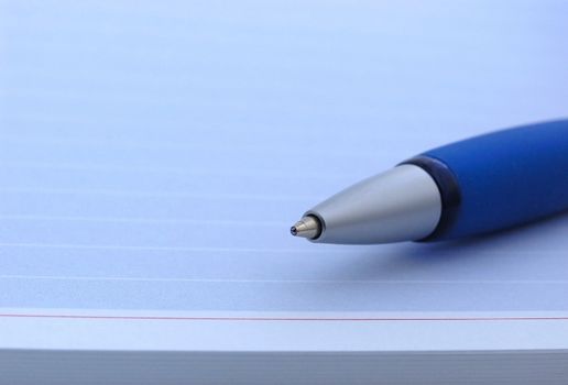 blue pen on a blue notebook