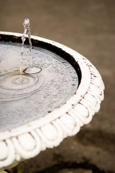 An old waterfountain in a urban area