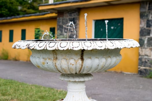 An old waterfountain in a urban area