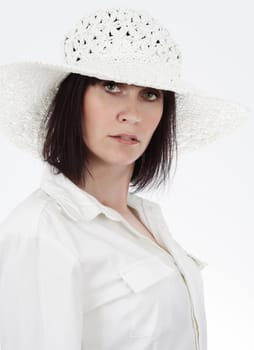 portrait of beautiful woman wearing white hat