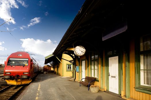 An old train station against a deep blue sky