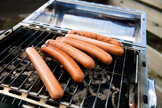 hotdogs on a barbeque