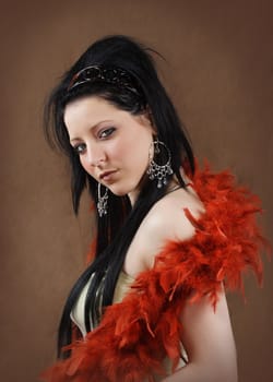 beautiful young woman with red feather boa