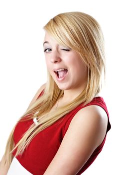 Blond teen girl winking, isolated on white