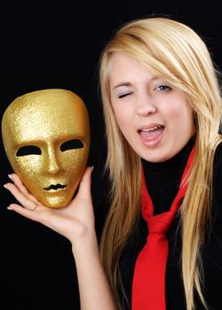 blond teen girl with gold mask, black background