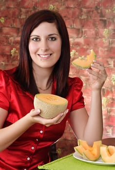 young woman with a piece of cantaloup