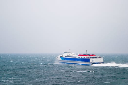 A speed ferry catamaran on the Ocean