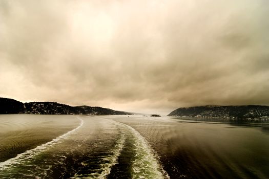 Boat froth from a cruise ship on an abstract landscape