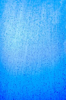 Blue rain background texture image with drops running