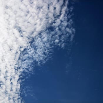 Cloud formations against blue sky.