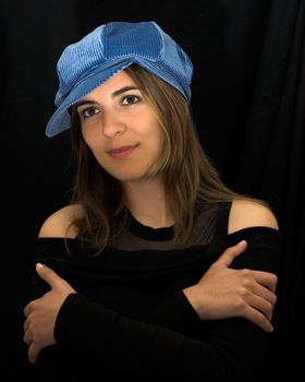 Beautiful woman portrait with a blue cap