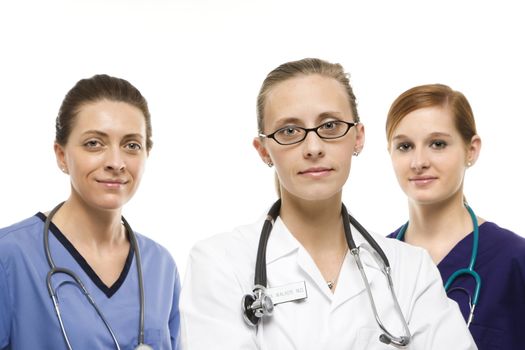 Portrait of Caucasian women medical healthcare workers in uniforms against white background.