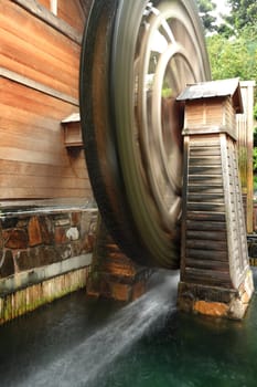 wooden waterwheel is rotating