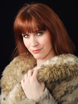 ginger-haired woman with factitious fur coat