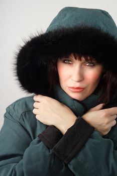 woman wearing green winter coat