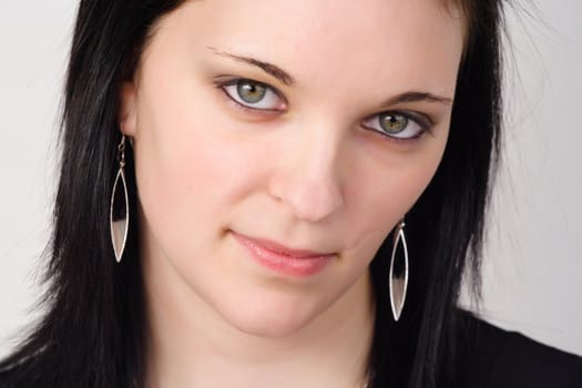 closeup portrait of a young woman with black hair