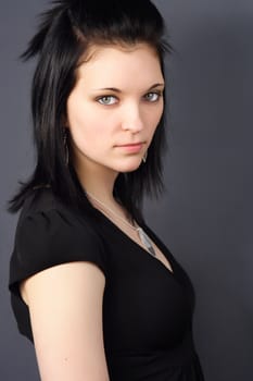 closeup portrait of a young woman with black hair