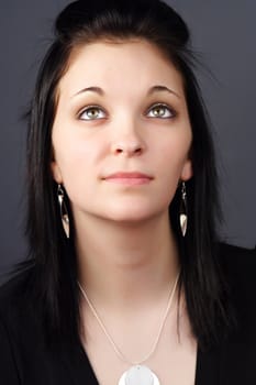 closeup portrait of a young woman with black hair