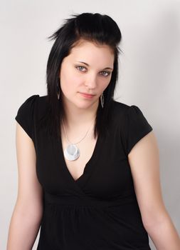 closeup portrait of a young woman with black hair