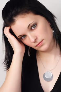 closeup portrait of a young woman with black hair