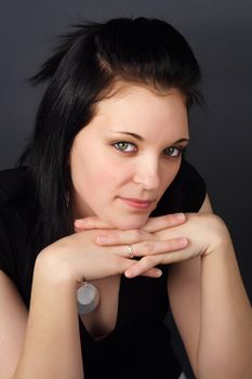 closeup portrait of a young woman with black hair