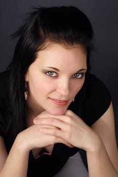 closeup portrait of a young woman with black hair