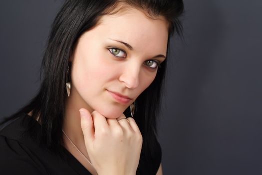 closeup portrait of a young woman with black hair